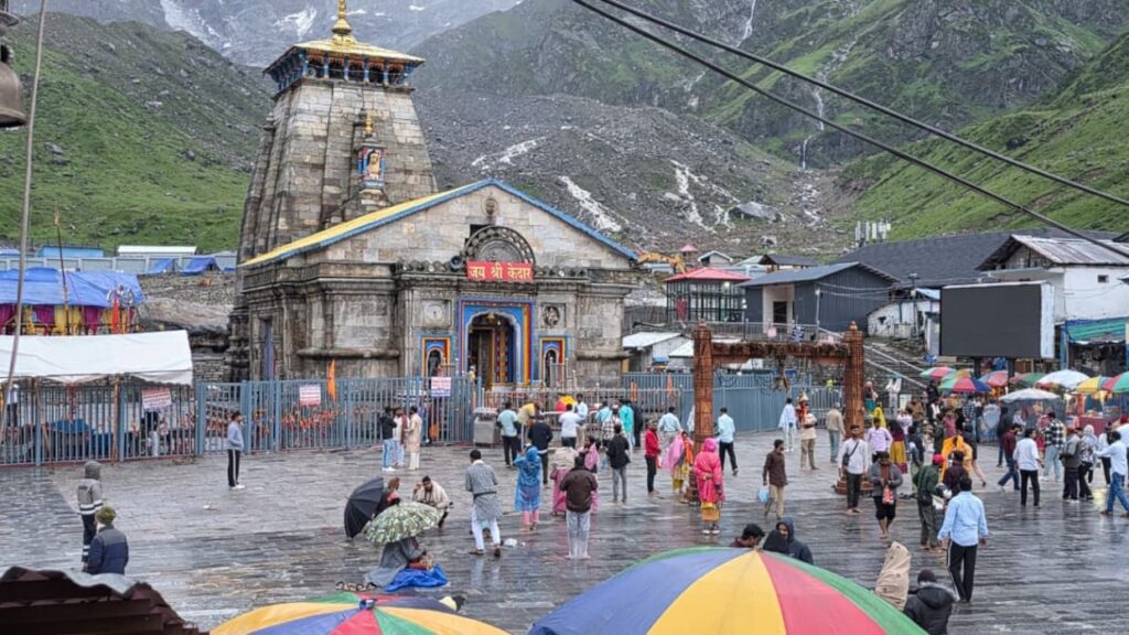 pilgrims walking through fog on the kedarnath yatra route during heavy rain